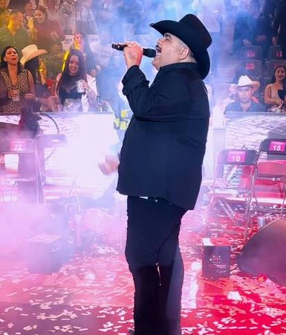 Chuy Lizarraga performing on tour